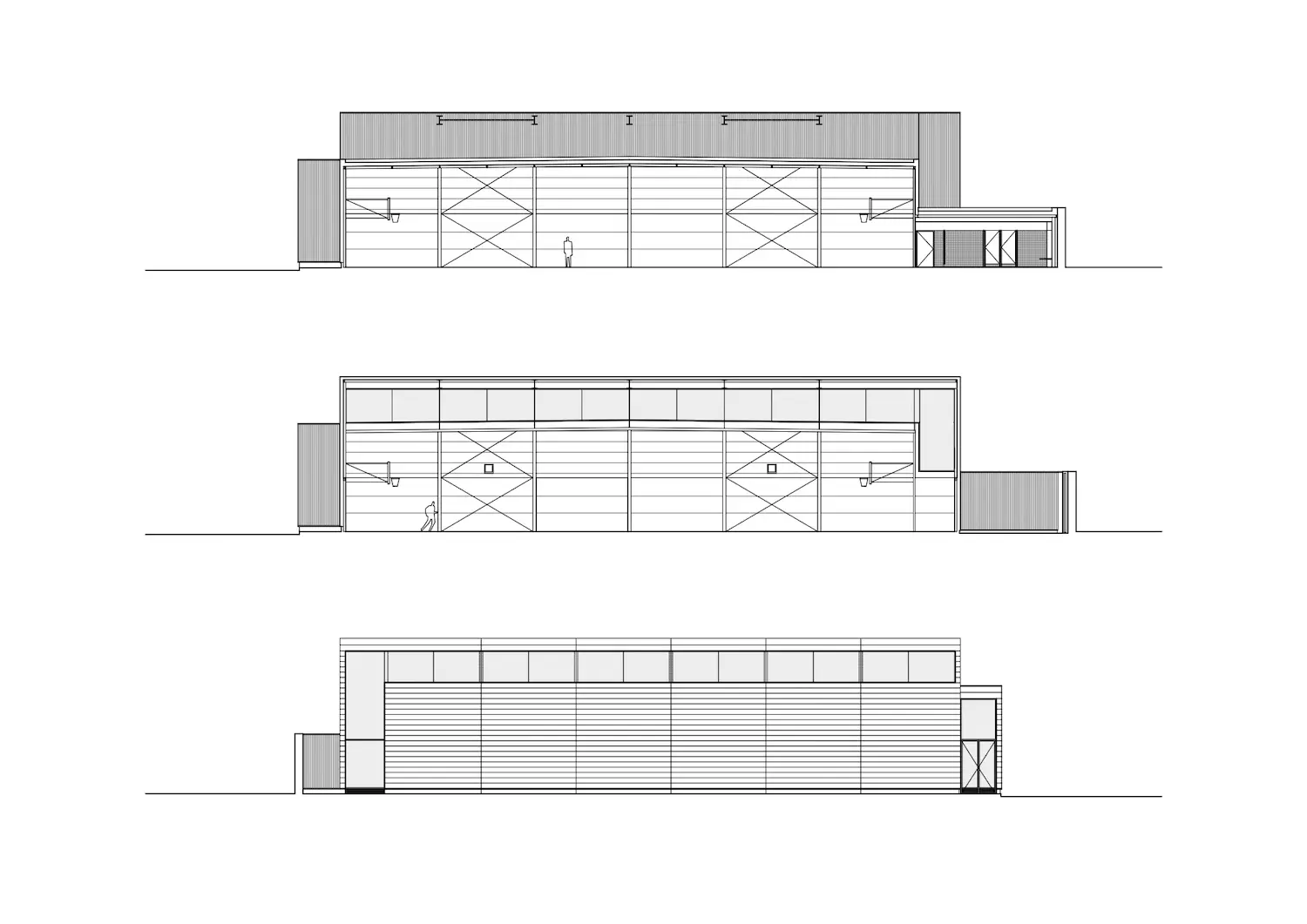 Dibujos de alzados arquitectónicos de un edificio industrial rectangular mostrado desde tres ángulos, con grandes puertas, ventanas y una pequeña zona de entrada. En dos de las vistas, una figura humana proporciona la escala.