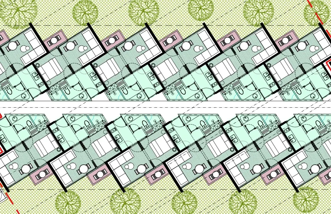 Plano arquitectónico que muestra dos hileras reflejadas de pequeñas viviendas rectangulares con baño y cocina, dispuestas en diagonal a lo largo de un camino central, y árboles verdes dispersos en el fondo.